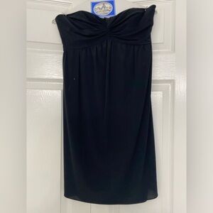 Little black dress. Strapless and short/cocktail.